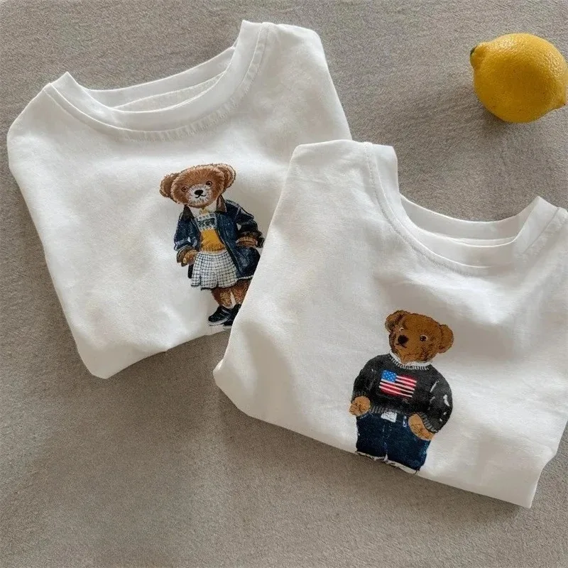 Baby Products Ads - เสื้อยืดเด็ก 2026 รุ่นใหม่ฤดูร้อน สำหรับเด็กชายและเด็กหญิง ลายการ์ตูนหมีเท็ดดี้ แขนสั้น